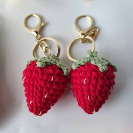 Two crochet strawberry keyrings with metal clasps
